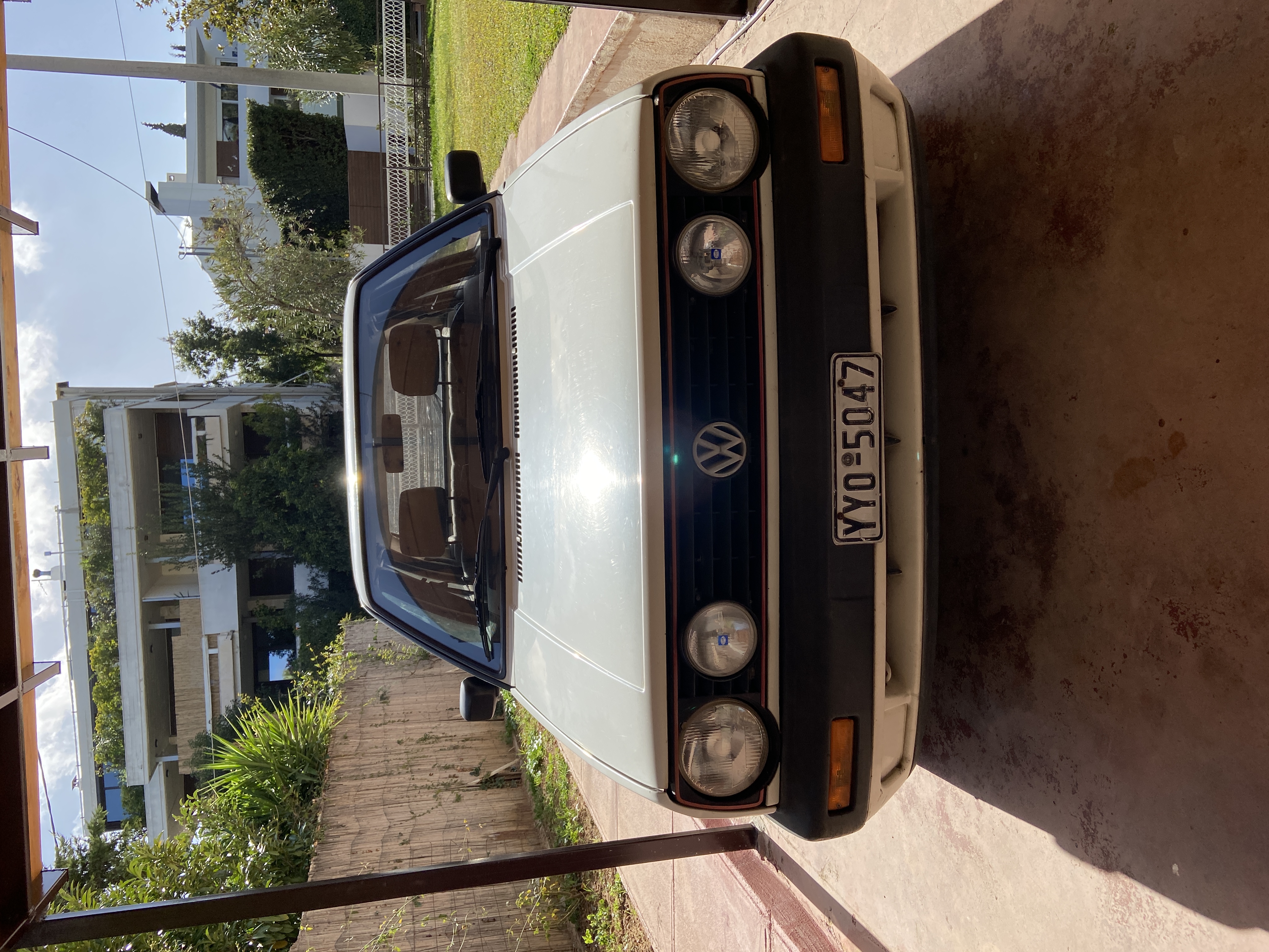 A white Volkswagen photographed at home